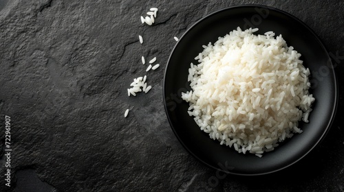 Top view white rice on black bowl isolated on a grey background. AI generated image photo