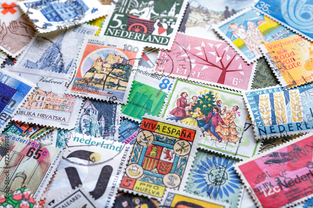 Ukraine, Kiyiv - January 12, 2023.Postage stamps.A collection of world stamps in a pile.Postage stamps from different countries and times