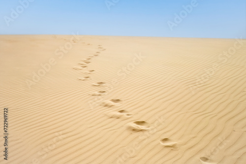 Desert walk  footprints in sand of Viana desert to the horizon in Boa Vista island   Cape Verde. 