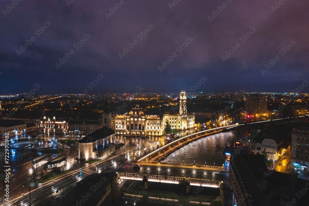 Fototapeta premium Glowing Tapestry: A Mesmerizing Nighttime Aerial View of Oradea, Bihor, Romania