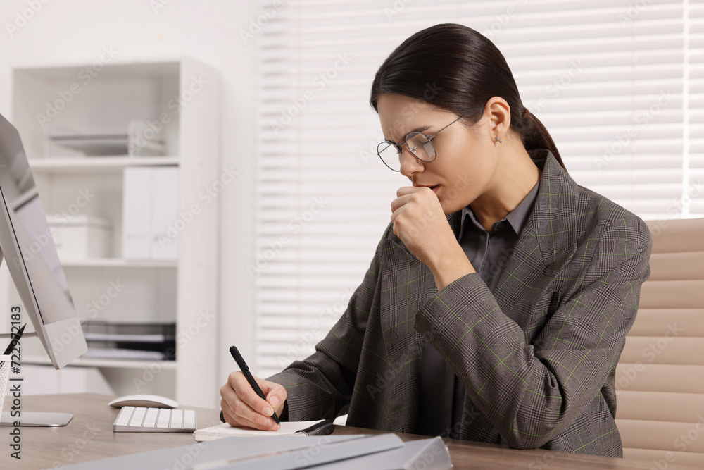 Woman coughing while taking notes at table in office, space for text. Cold symptoms Woman coughing while taking notes at table in office, space for text. Cold symptoms