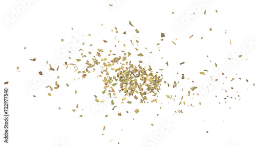 Dried and chopped up basil spice pile isolated on white background, top view photo