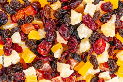 Top view of various dried tropical fruit background. Delicious various dried fruit, raisin, papaya, cranberry, pineapple and mango.