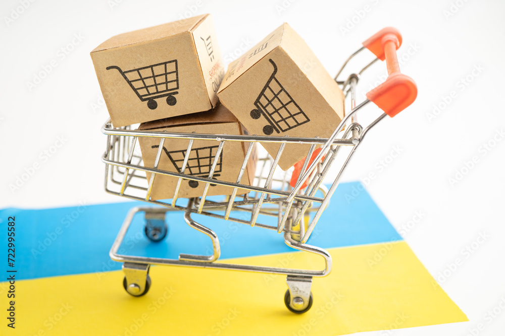 Box with shopping online cart logo and Ukraine flag, Import Export Shopping online or commerce finance delivery service store product shipping, trade, supplier.