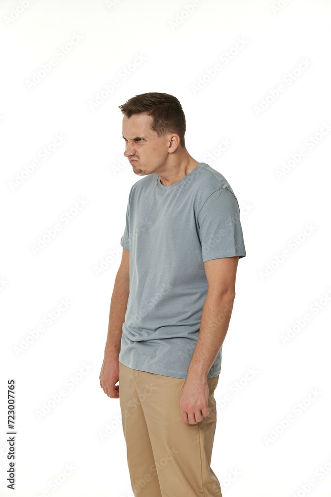 annoyed angry man standing on white studio background annoyed angry man standing on white studio background
