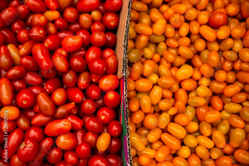 red and yellow grape tomatoes for sale at the markets photo