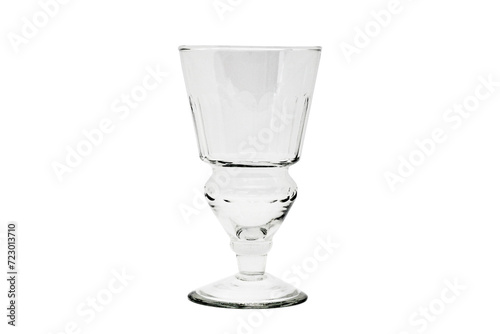 Empty absinthe or wine glass isolated on white background.