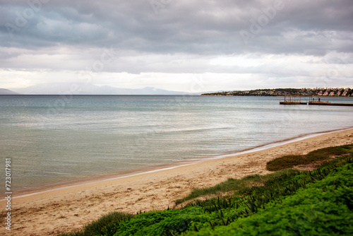 Beach and ocean with cloudy sky in the background. Beautiful landscape. vertical