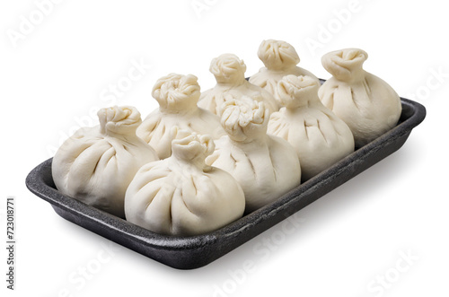 Khinkali in a tray close-up on a white background. Isolated