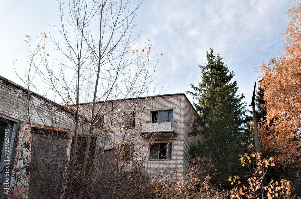 old brick house with balcony and trees in Chernobyl old brick house with balcony and trees in Chernobyl