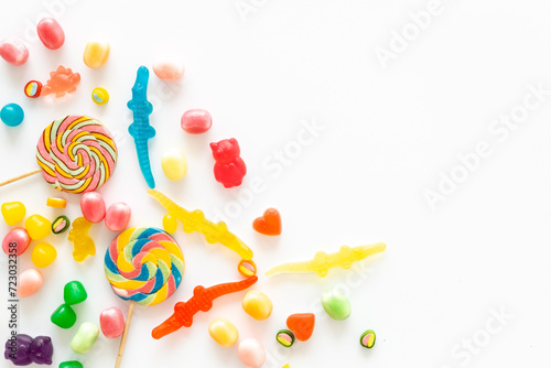 Food pattern. Sweets and candies background. Many different lollipops top view