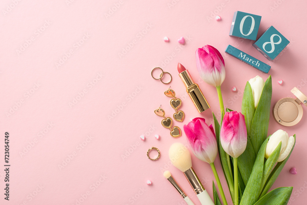 March Glamour: top view chic display capturing essence of perfect lady with tulips, cube calendar set to March 8, eyeshadow, lipstick, brushes, jewelry, and tiny hearts on a pastel pink background
