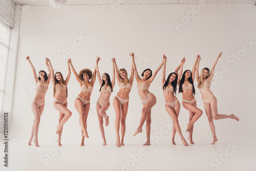 No filer photo of multiethnic group girls feminists raise hands support loving your beautiful body isolated pastel color background photo