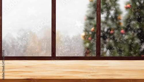 Wooden table with winter background and Merry Christmas.