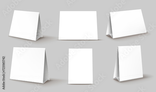 Note or calendar table card stand mockups, tent display or paper talker, realistic vector. 3D blank triangle tent card for menu display or trifold for table place card with white paper cardboard photo