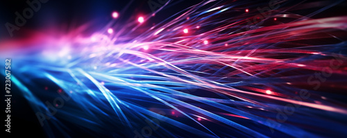 Close-up of optic fibers with dynamic blue and red light bokeh in the background