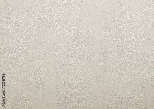 Background of gray wallpaper or plaster wall with vintage swirl pattern.