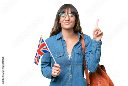 Young caucasian woman holding an United Kingdom flag over isolated background pointing up a great idea photo