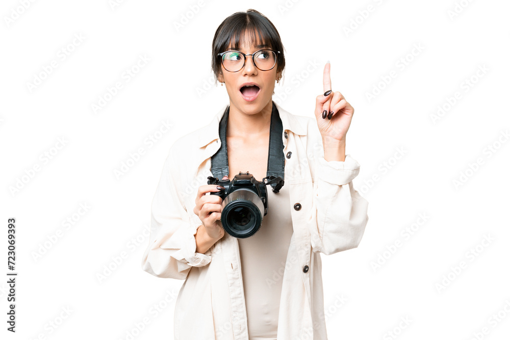 Young photographer caucasian woman over isolated chroma key background intending to realizes the solution while lifting a finger up Young photographer caucasian woman over isolated chroma key background intending to realizes the solution while lifting a finger up