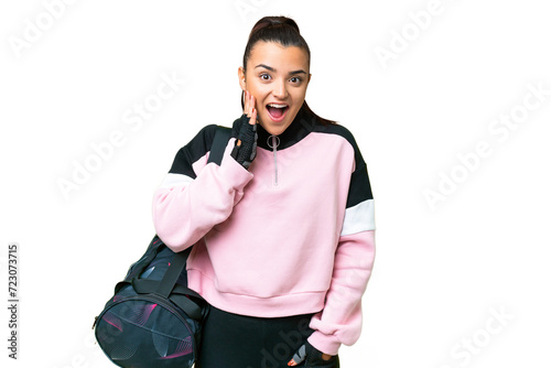 Young sport woman with sport bag over isolated chroma key background with surprise and shocked facial expression © luismolinero