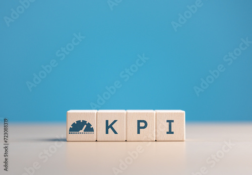 Fototapeta Naklejka Na Ścianę i Meble -  Wooden cubes with a KPI word and icons. Key Performance Indicator (KPI), business goals, performance check and indicators results, business planning and measure for success, target goal achievement.