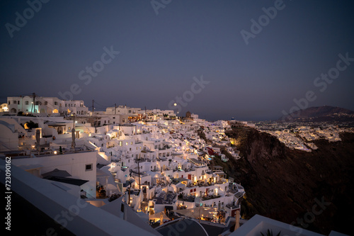 View of Imerovigli village in Santorini at sunset with city lights © Aalez