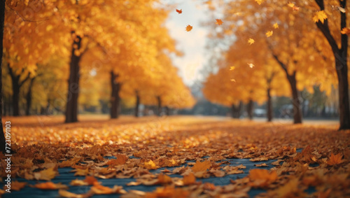 Beautiful autumn background landscape. Carpet of fallen orange autumn leaves in park and blue umbrella. Leaves fly in wind in sunlight. Concept of Golden autumn ai image 