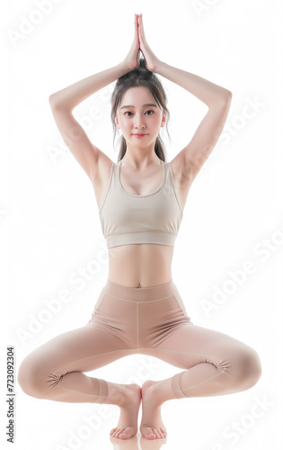 Beautiful woman wearing fitness clothe while doing yoga.