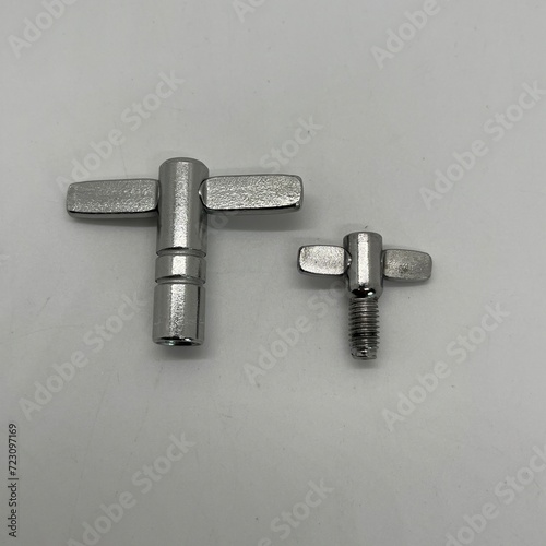 Drum Key and Pedal Wing Screw on White Background