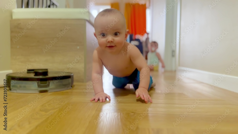 baby crawling on the floor twins play having fun. happy family child dream concept. baby boy fun crawling on the floor in the hallway first steps. baby twins crawls plays at home lifestyle baby crawling on the floor twins play having fun. happy family child dream concept. baby boy fun crawling on the floor in the hallway first steps. baby twins crawls plays at home lifestyle