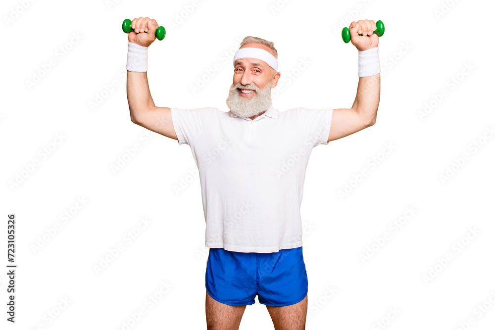 Fototapeta premium Body care, hobby, weight loss lifestyle. Cheerful cool grandpa with humor grimace exercising holding equipment up, lifts it with strength and power, wearing blue sexy shorts, so hot!