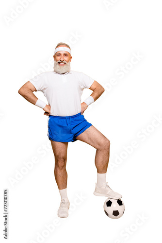 Full length of modern cool funny competetive pensioner, leader, champion with his foot on a ball. Bodycare, healthcare, weight loss, pride, strength, leadership, motivation, authority, gym © deagreez