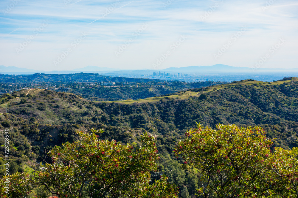 Canyon Back trail in the Santa Monica Mountains with Downtown Los Angeles in the background on a clear blue sky day in the winter.