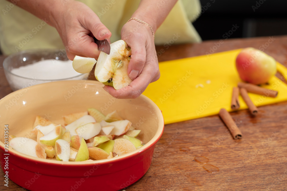 Hands cutting apples with a knife. Cooking apple pie. Hands cutting apples with a knife. Cooking apple pie.