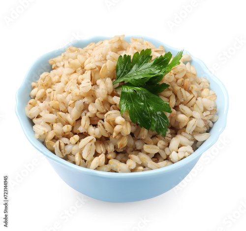 Delicious pearl barley with parsley in bowl isolated on white