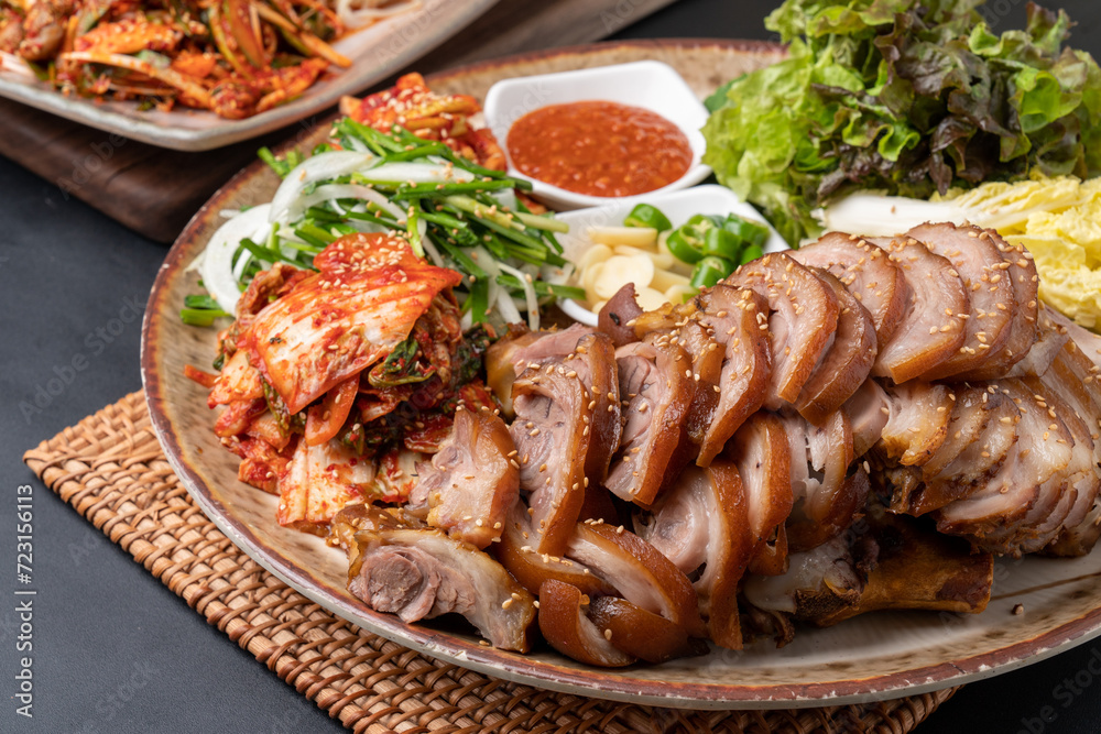 Steamed pork feet, jokbal, spicy pork feet, sea snail, seasoned spicy fish, tray noodles, Korean food, traditional food, pork