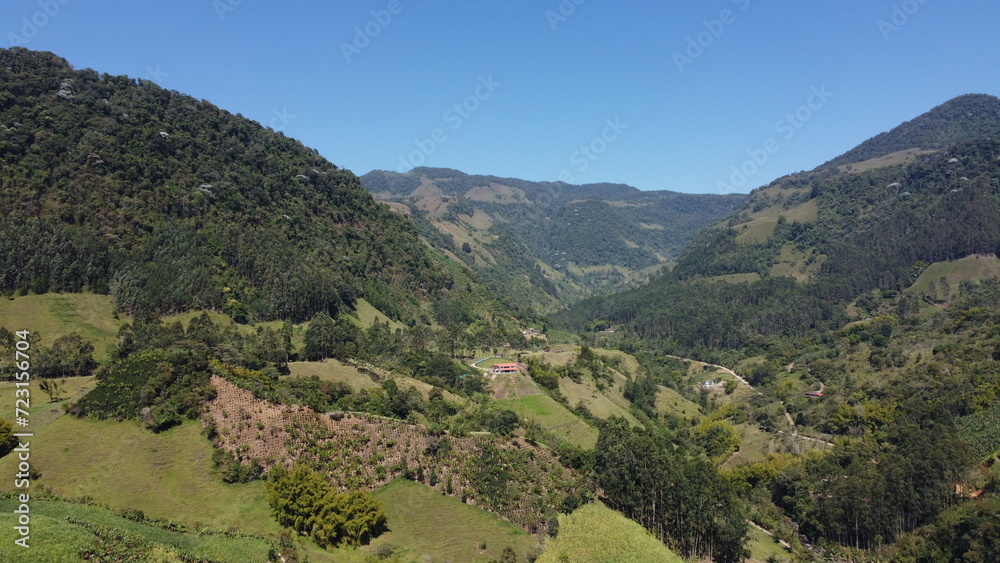 Valley of mountains full of nature, beautiful trees and plants, blue sky, Colombia, Antioquia, Latin