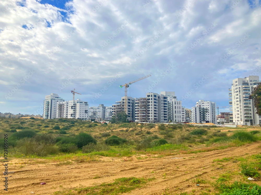 Construction in the desert. Panorama of a large residential complex construction. Israeli new buildings. Real estate in the Middle East Construction in the desert. Panorama of a large residential complex construction. Israeli new buildings. Real estate in the Middle East