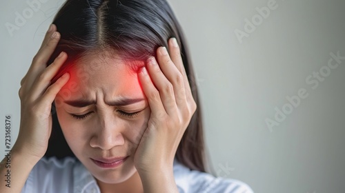 Woman hands on his head felling headache dizzy sense of spinning dizziness. Vertigo illness concept. photo