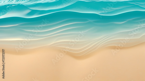 Sandy beach with light blue transparent water waves and sunlight  tranquil aerial beach scene