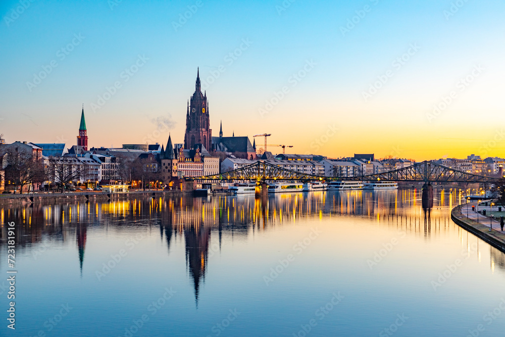 Fototapeta premium scenic skyline of Frankfurt am Main with reflection in the river, Germany