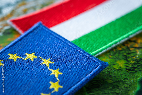Hungary and european union patches overlapping on europe map, concept of cooperation between union countries, flags of hungary and european union