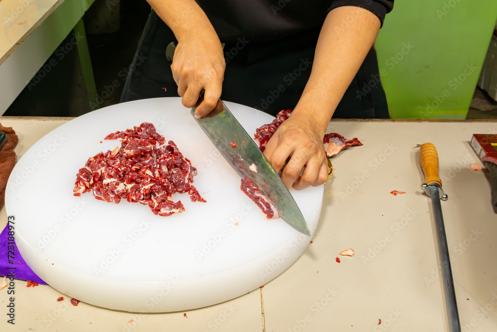 man slicing the beef thinly