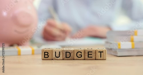 Person writes financial reports and business budget planning photo