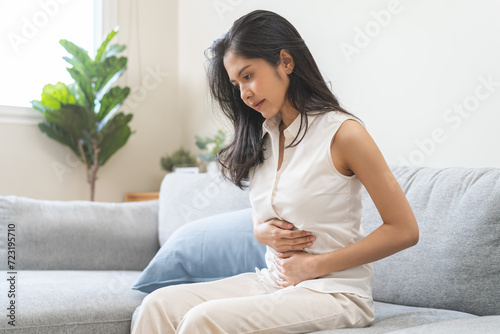 Flatulence ulcer, asian young woman, girl hands in belly, stomach pain from food poisoning, abdominal pain and digestive problem, gastritis or diarrhoea. Abdomen inflammation, menstrual period people.