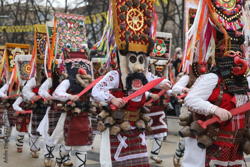 Pernik, Bulgaria - January 27, 2024: The 30th International masquerade festival Surva in Pernik, Bulgaria. People with mask called Kukeri dance and perform to scare the evil spirits. photo