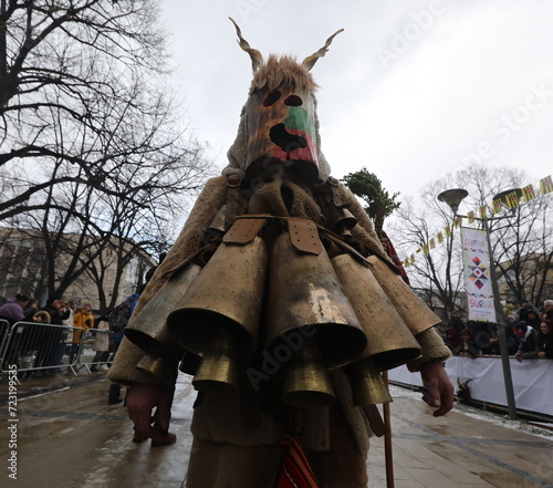 Pernik, Bulgaria - January 27, 2024: The 30th International masquerade festival Surva in Pernik, Bulgaria. People with mask called Kukeri dance and perform to scare the evil spirits. photo