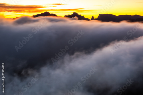 Mountains peaks at sunrise above fog in Madeira