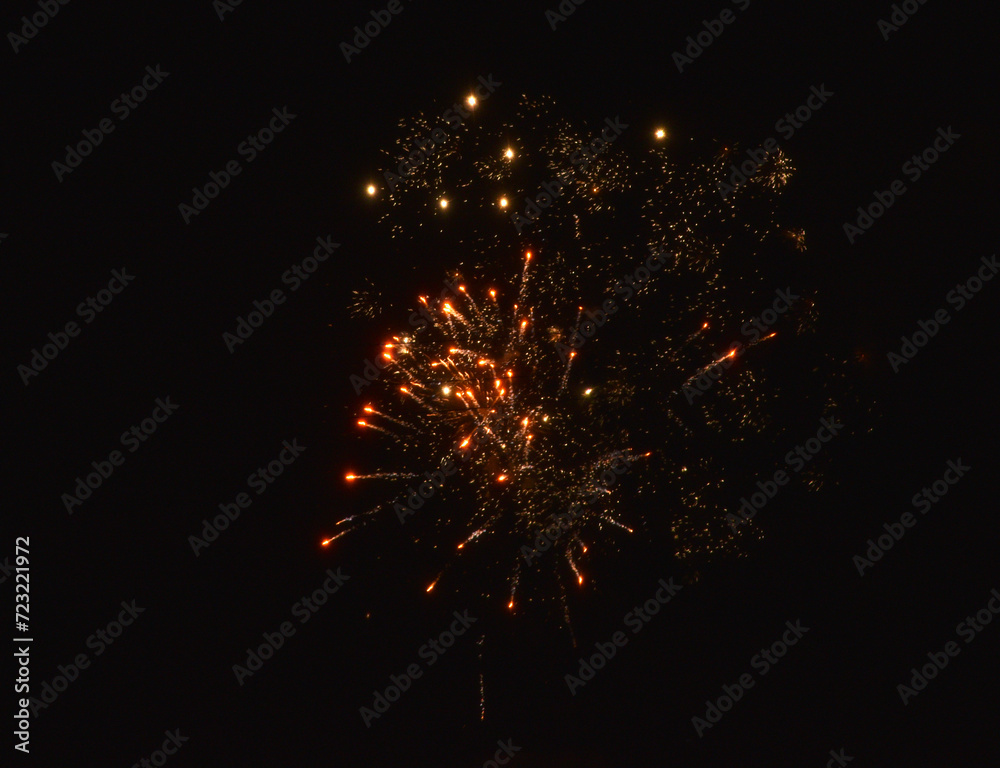 Fireworks shot at night. New Year's fireworks in the black sky. Christmas lights. Fireworks shot at night. New Year's fireworks in the black sky. Christmas lights.