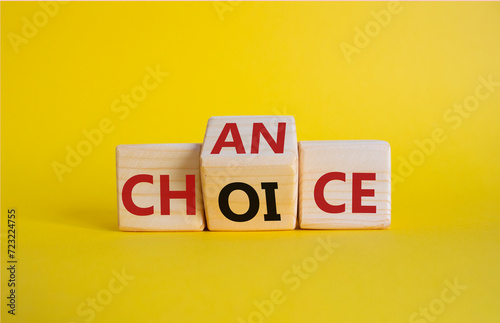 Chance and Choice symbol. Wooden cubes with words Choice and Chance. Beautiful yellow background. Chance and Choice and business concept. Copy space